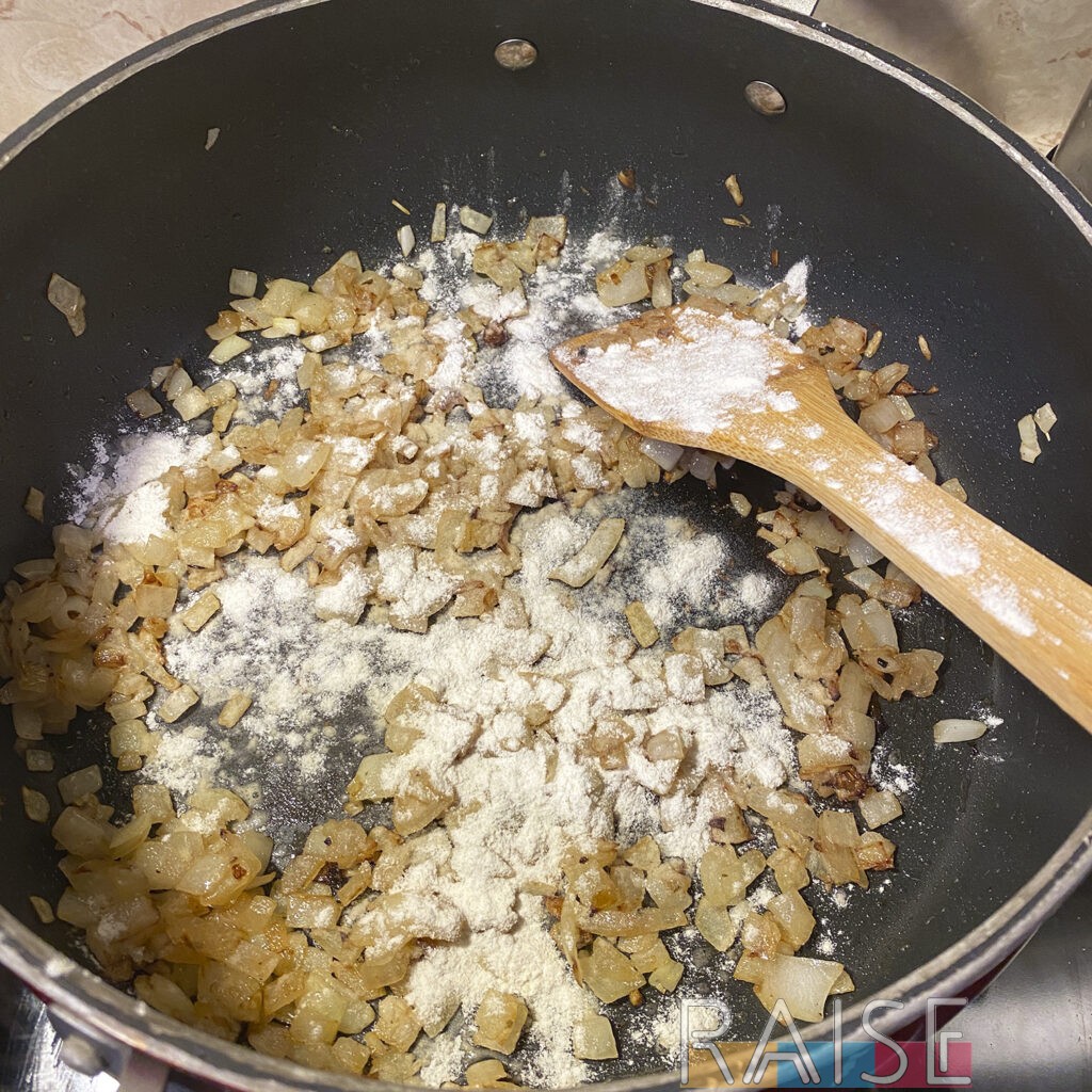 Flour Added to Onions for Vegan Gluten Free Mac and Cheese by The Allergy Chef