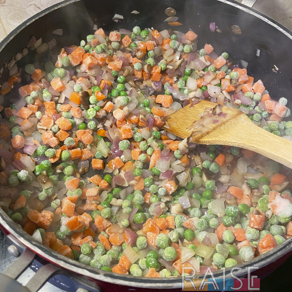 Frozen Veggies Added to Fried Rice Pan by The Allergy Chef