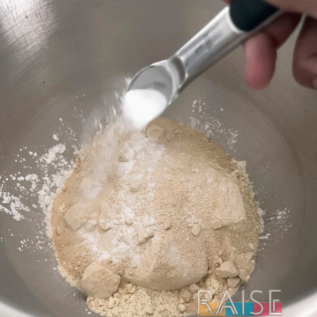 Adding Baking Powder to Mixing Bowl by The Allergy Chef