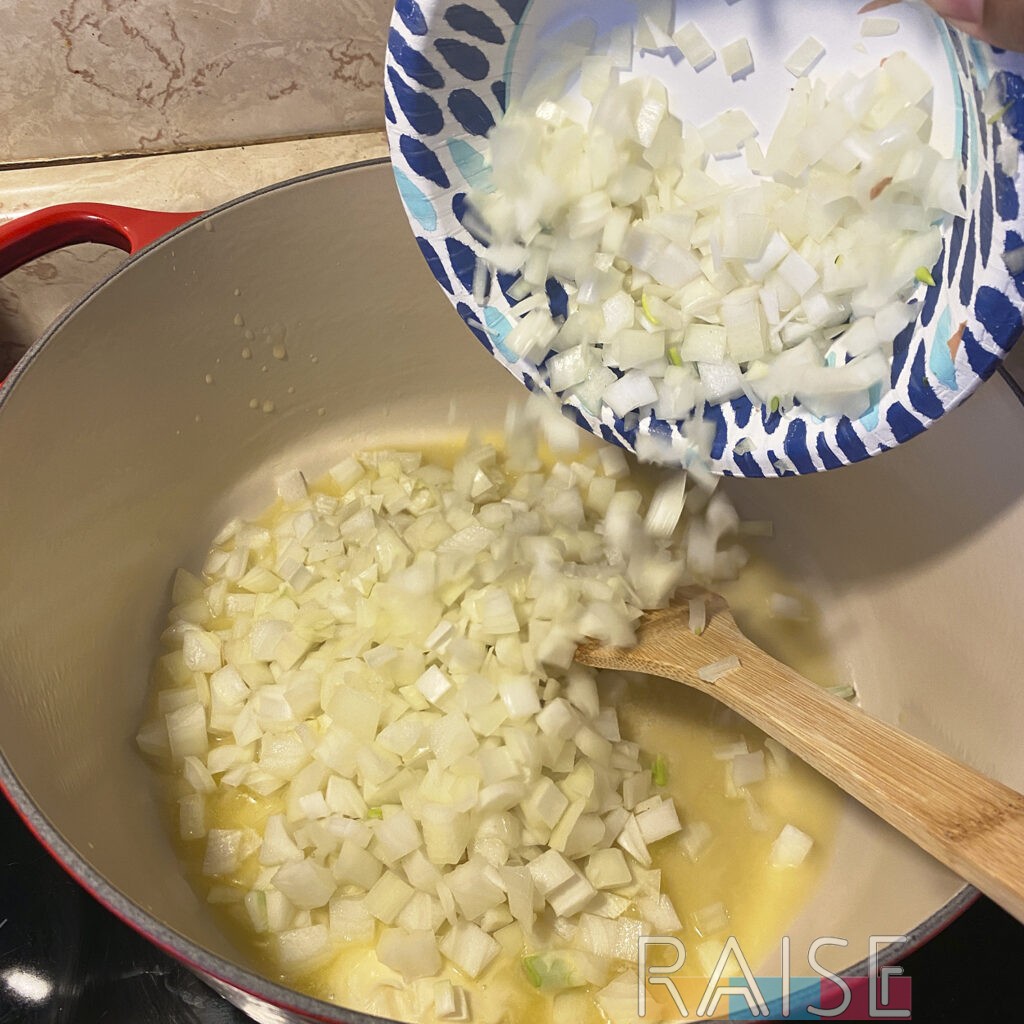 Adding Diced Onions to Dutch Oven by The Allergy Chef