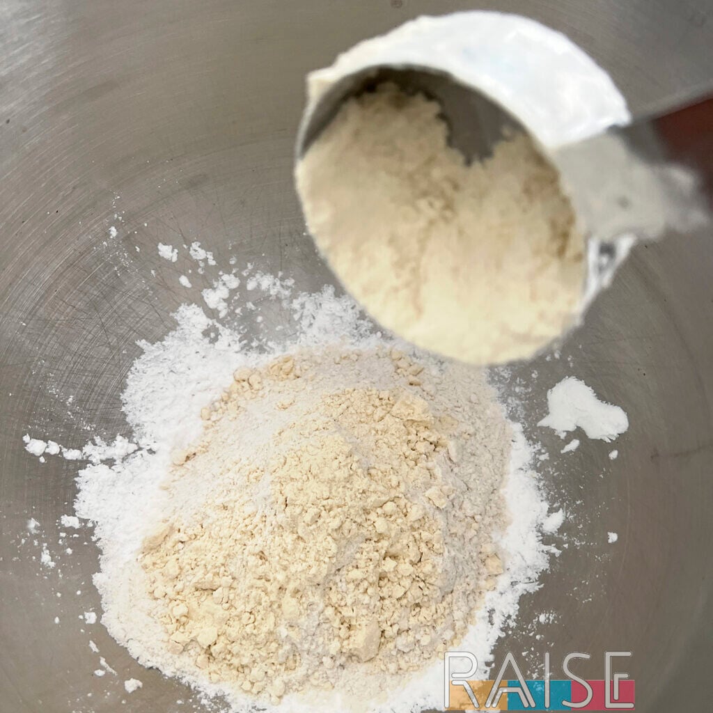 Adding Flour to Mixing Bowl for Cake by The Allergy Chef