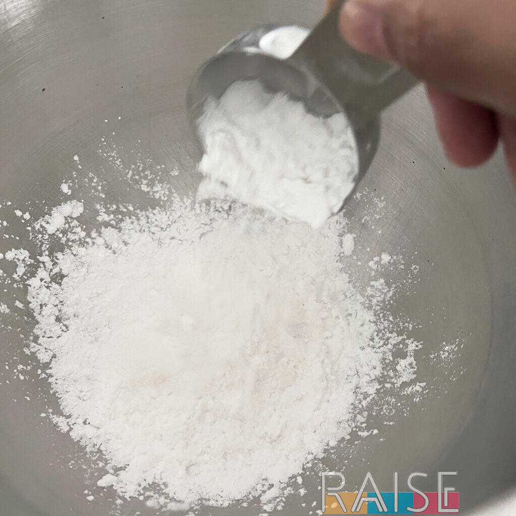 Adding Flour to the Dry Ingredients by The Allergy Chef