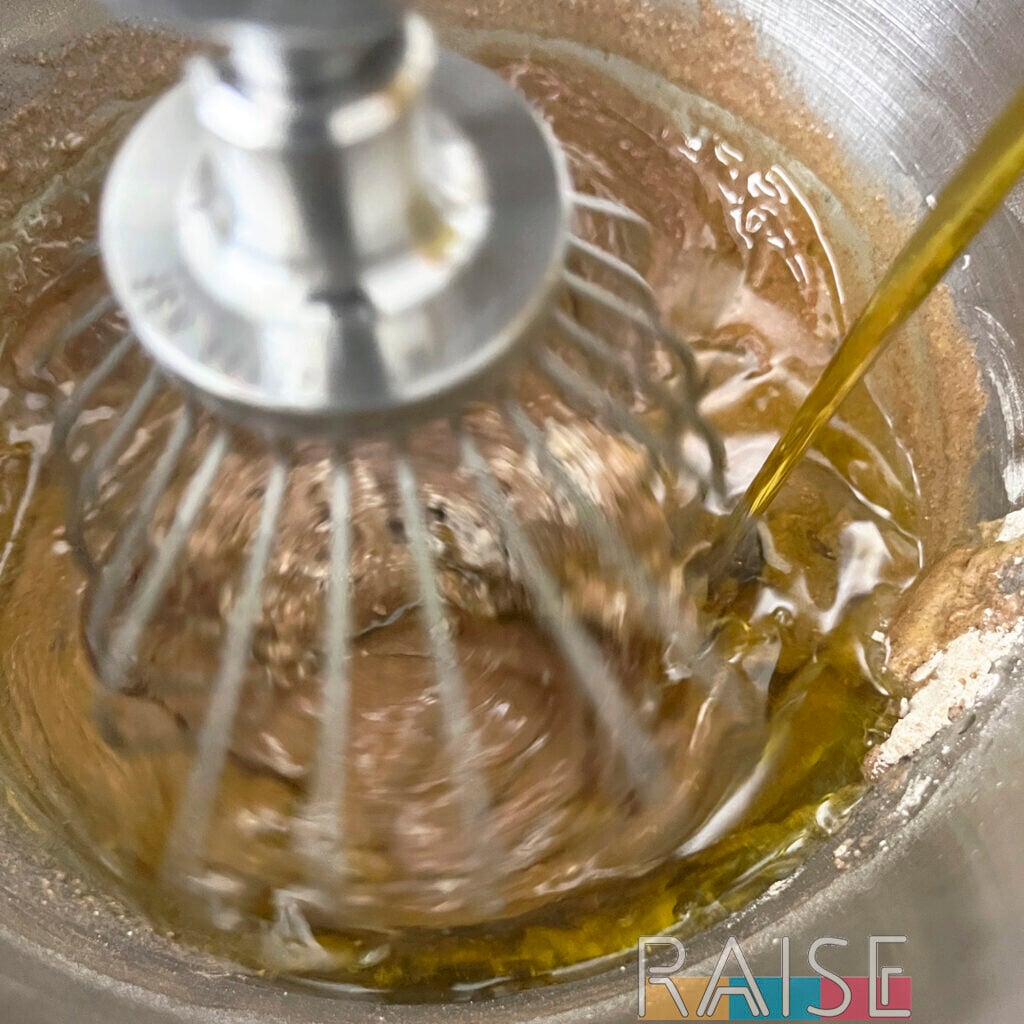 Adding Olive Oil to Cake Batter in Mixing Bowl by The Allergy Chef