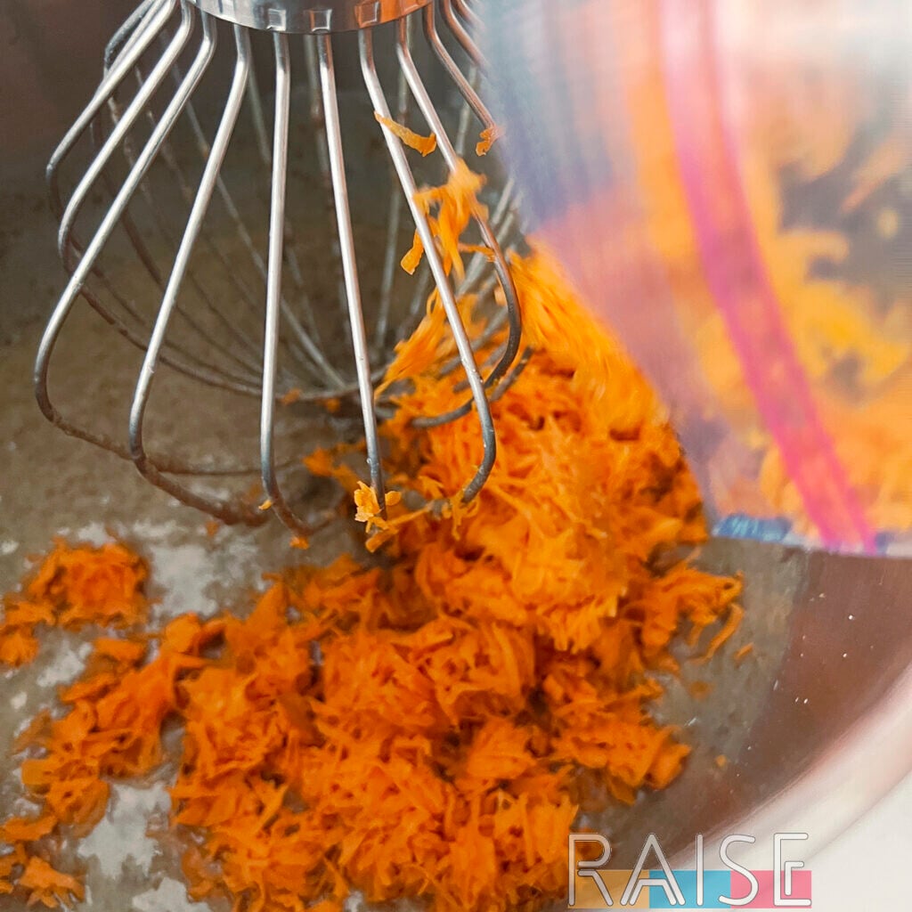 Adding Shredded Carrots to Mixing Bowl by The Allergy Chef