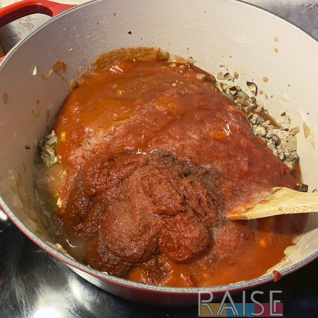 Adding Tomato Products to Dutch Oven by The Allergy Chef