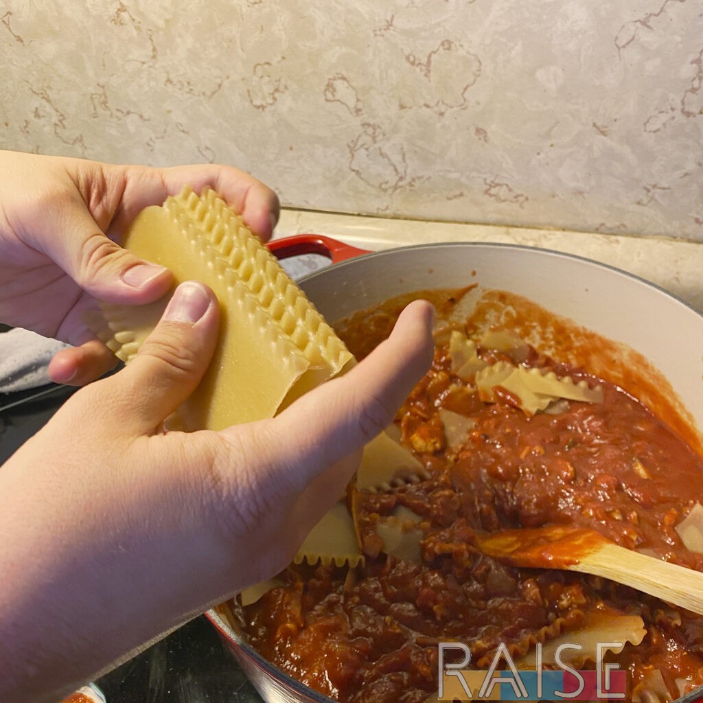 Breaking Gluten Free Lasagna Noodles Over Dutch Oven by The Allergy Chef