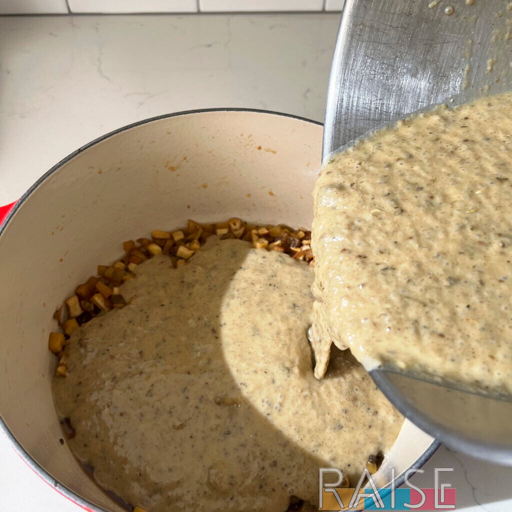 Pouring Apple Cake Batter into Dutch Oven by The Allergy Chef