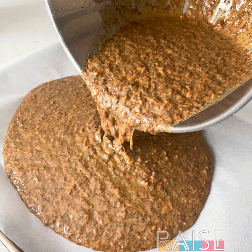 Pouring Low Histamine Cake Batter on to Baking Tray with Parchment by The Allergy Chef